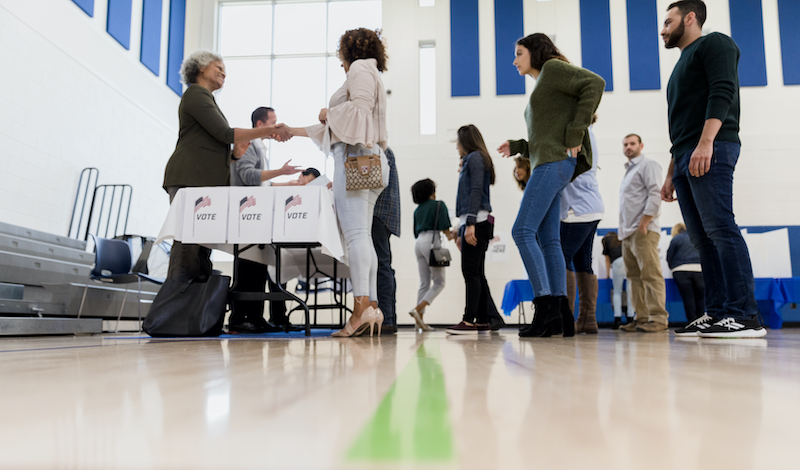 People standing in line to vote.