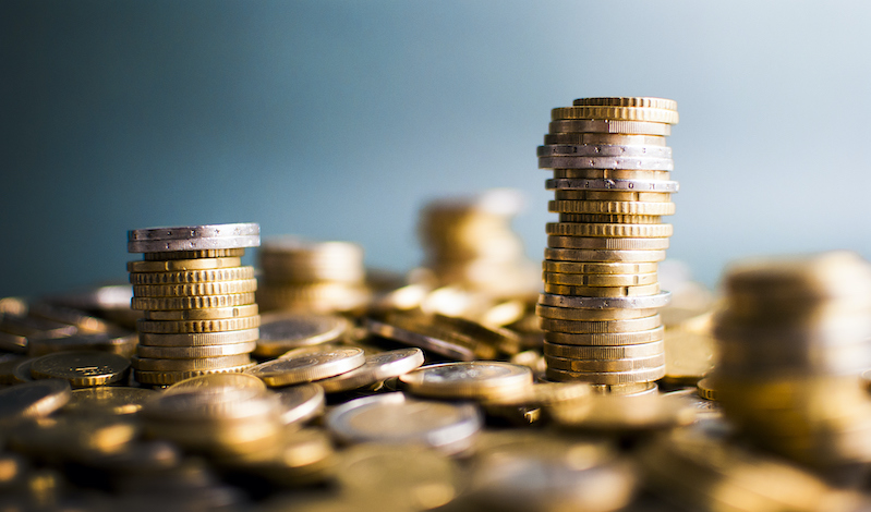 Euro coin stacks isolated in studio shot. Money and finance concept